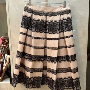 Light pink with black skirt